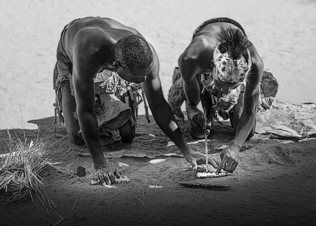 2 san men making fire