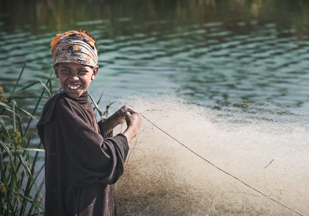 boy working at the fishmarket in awassa
