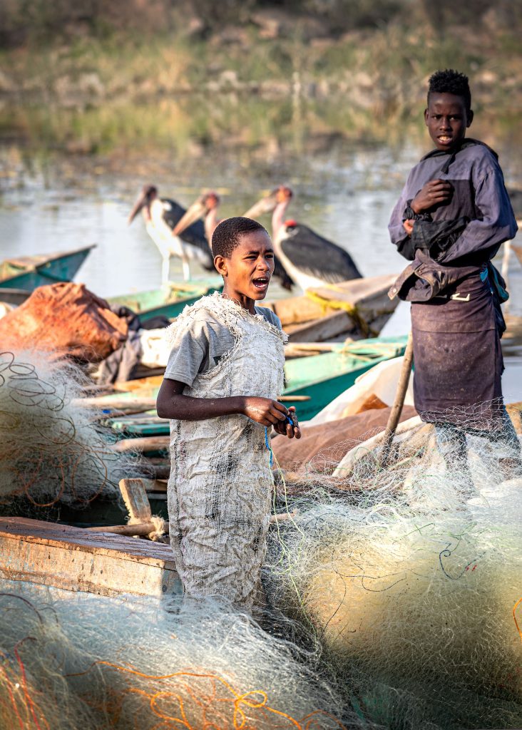 boys and their fishing nets