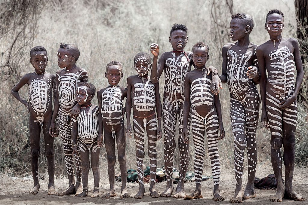 group of children with body painting