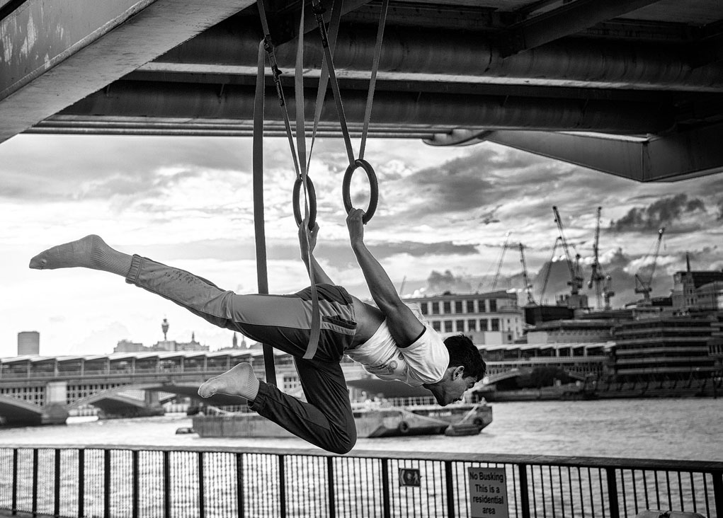 gymnast under the millenium bridge