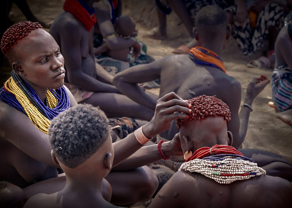 karo woman doing hair