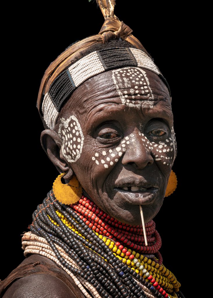 painted karo woman with a nail in her chin