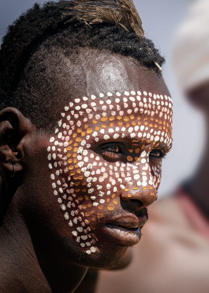 portrait of an arbore with tribal paint