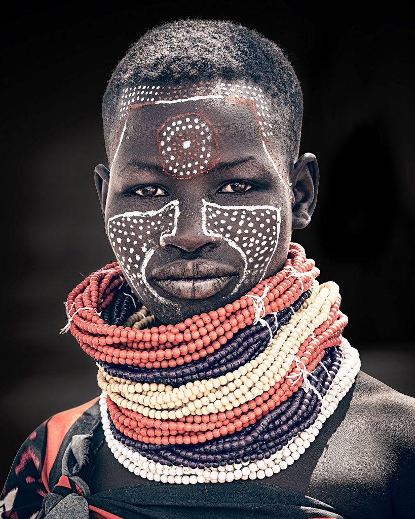 young karo woman with painted face